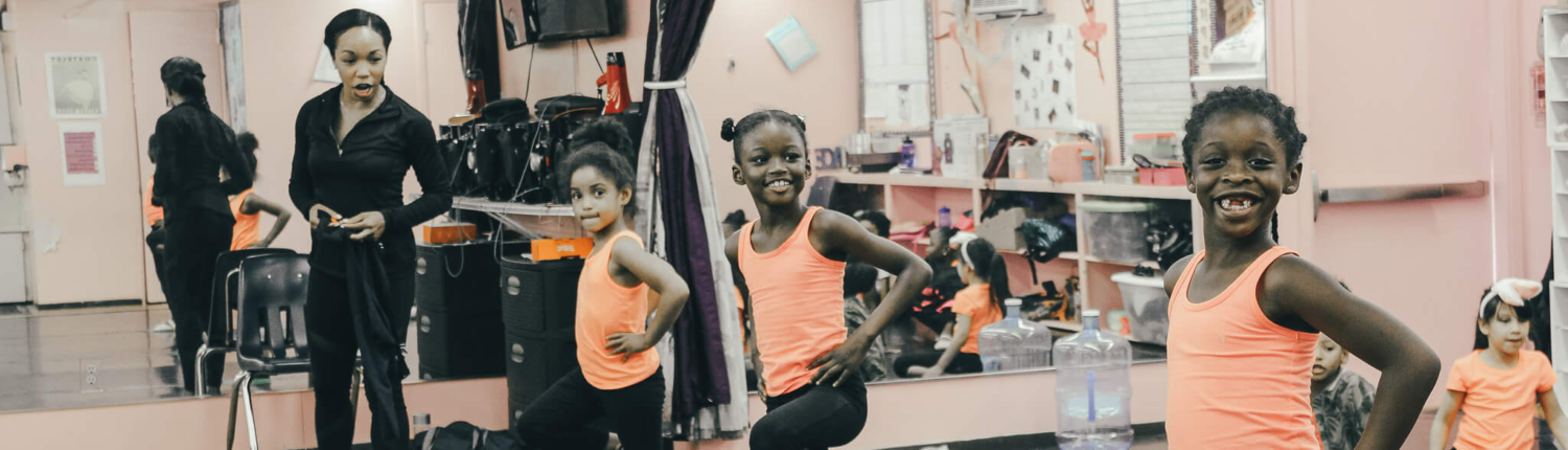 Three black girls dancing